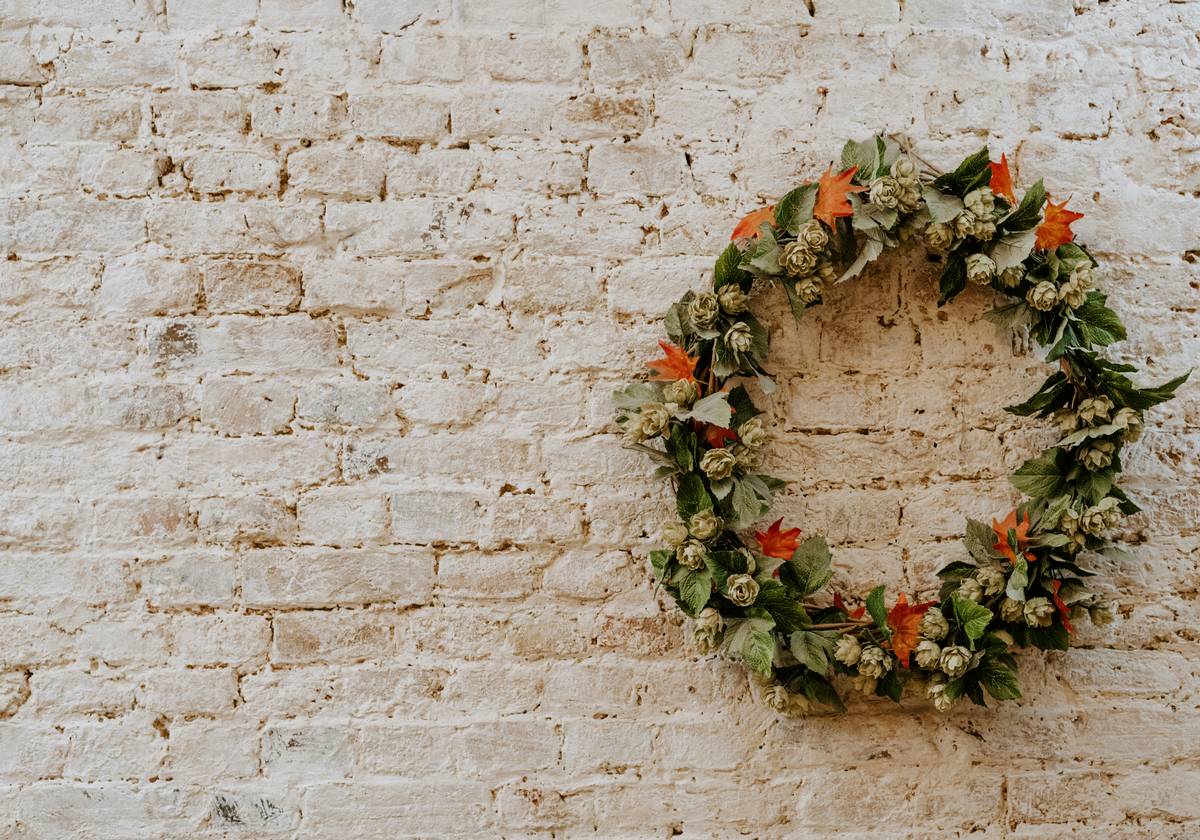 Close-up of securely wired decorations for wreath making showing hidden zip ties and floral wire reinforcement
